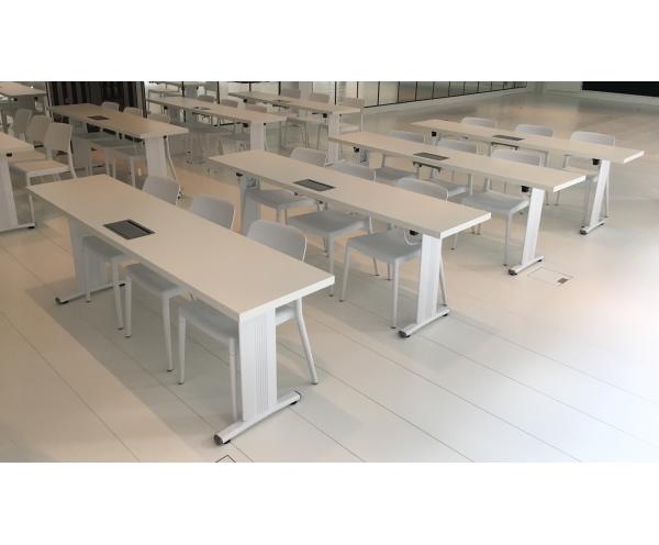 Narrow school tables with power outlets and custom white finish